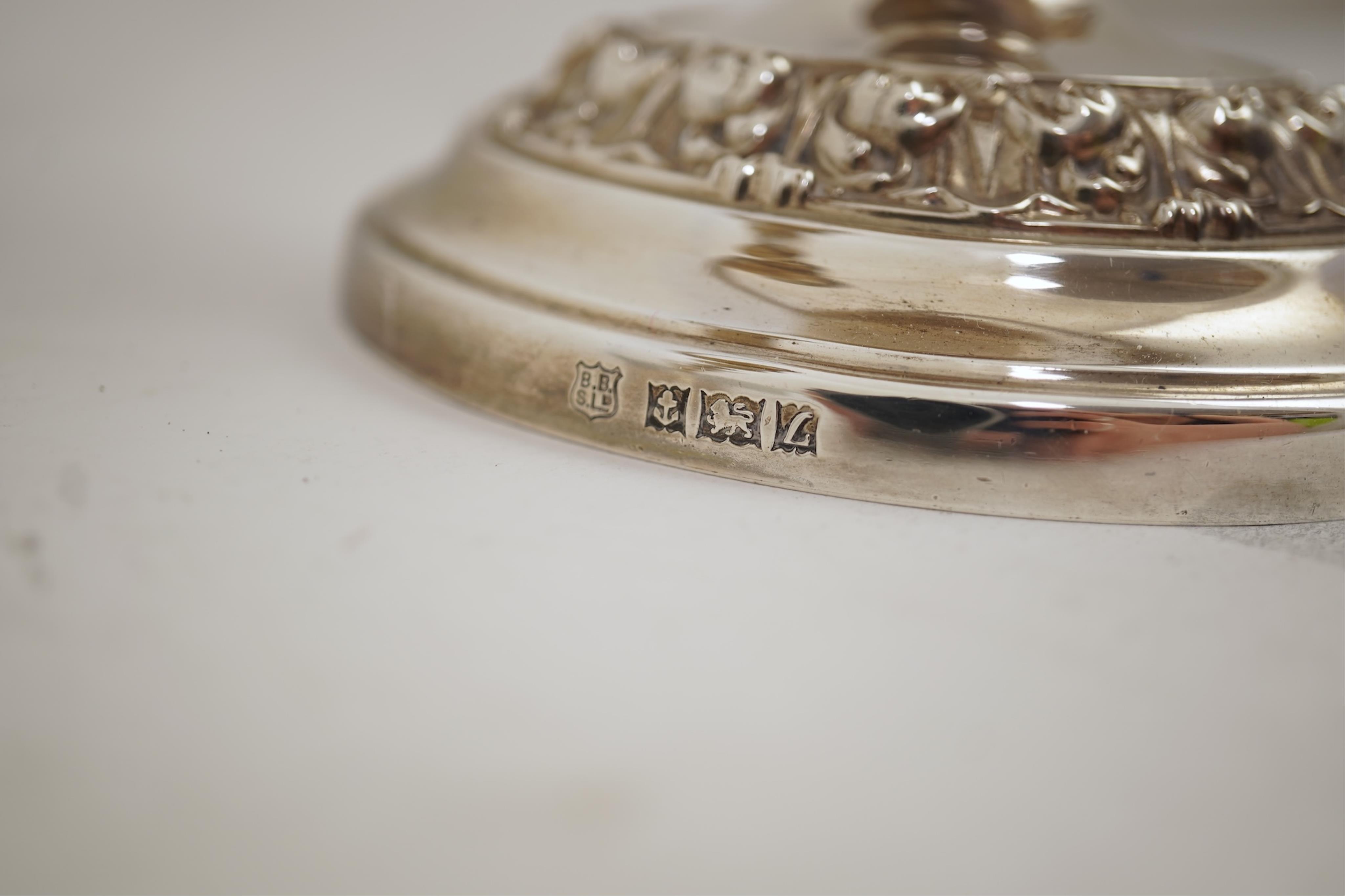 A pair of Elizabeth II silver dwarf two branch, three light candelabra by Barker Brothers Silver Co